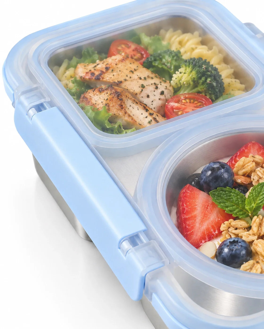 Close-up of the snack box filled with pasta salad, strawberries and granola